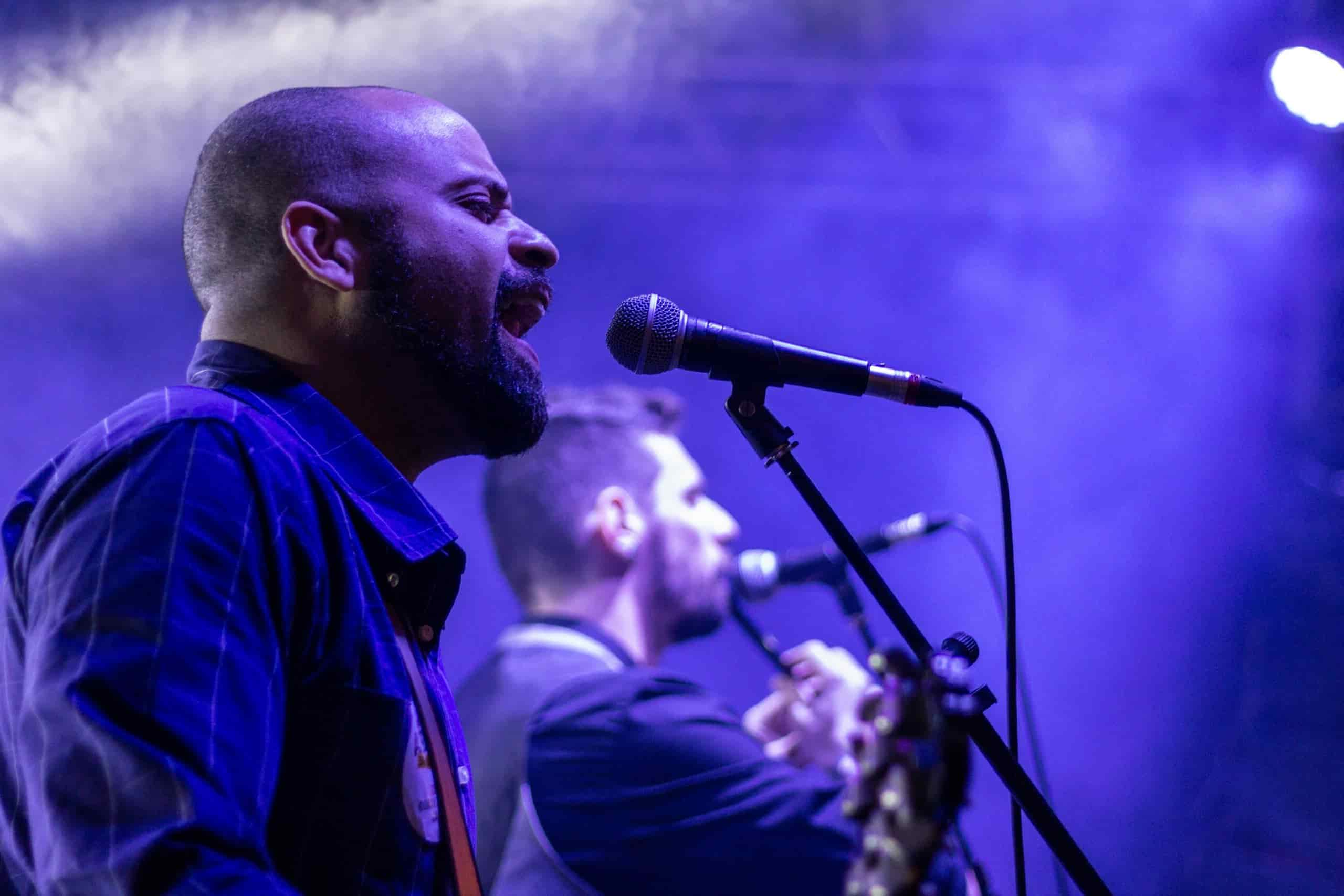 Man singing into microphone